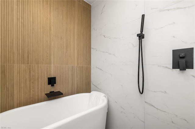 bathroom featuring a soaking tub