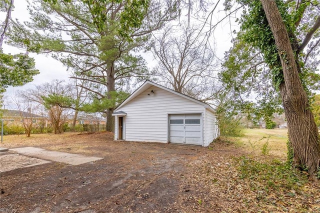 detached garage featuring driveway