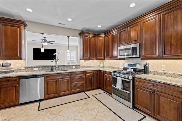 kitchen with visible vents, backsplash, appliances with stainless steel finishes, light tile patterned flooring, and a sink