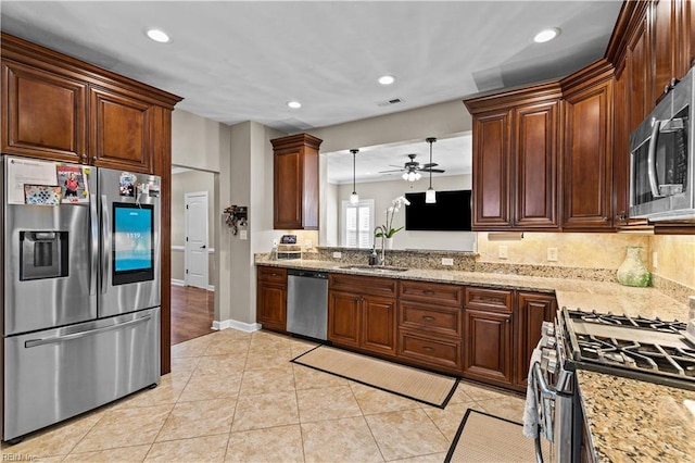 kitchen featuring visible vents, ceiling fan, light tile patterned floors, stainless steel appliances, and a sink