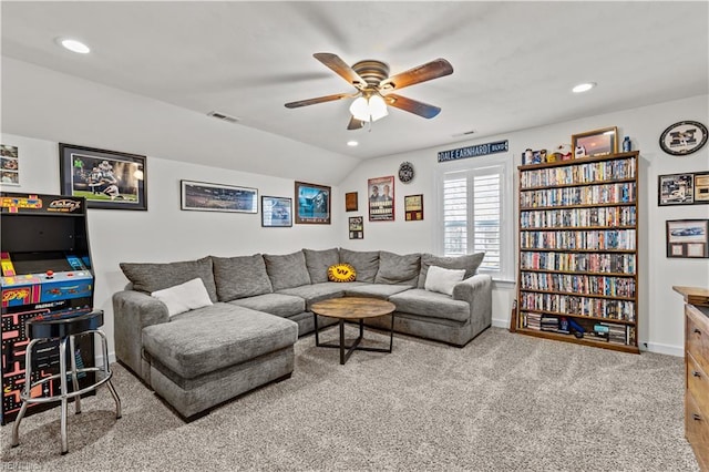 carpeted living area with visible vents, baseboards, vaulted ceiling, recessed lighting, and a ceiling fan