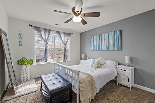 carpeted bedroom with a ceiling fan, baseboards, and visible vents