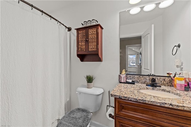 full bathroom featuring vanity and toilet