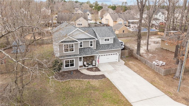 birds eye view of property with a residential view