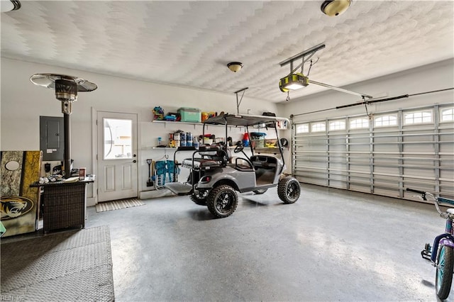 garage featuring electric panel and a garage door opener