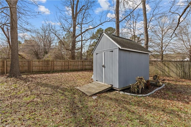 view of shed featuring a fenced backyard