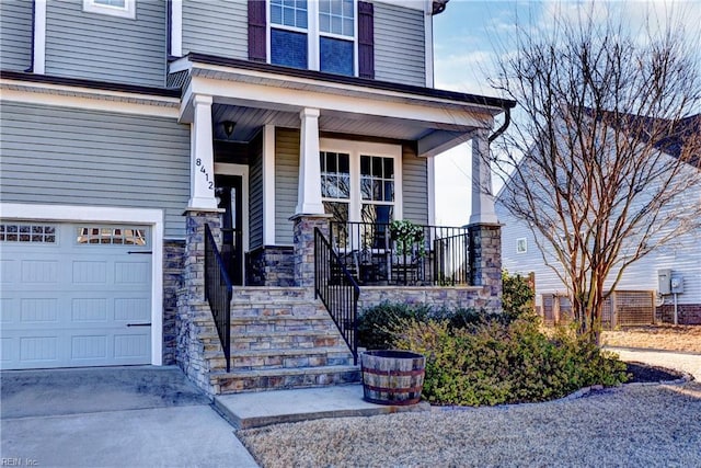 entrance to property with stone siding and a porch