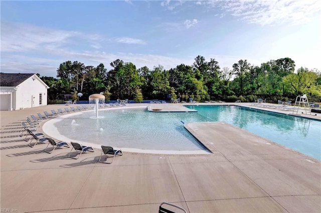 community pool with a patio area