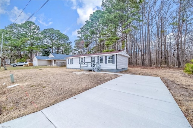 view of front of property with a garage, crawl space, and driveway