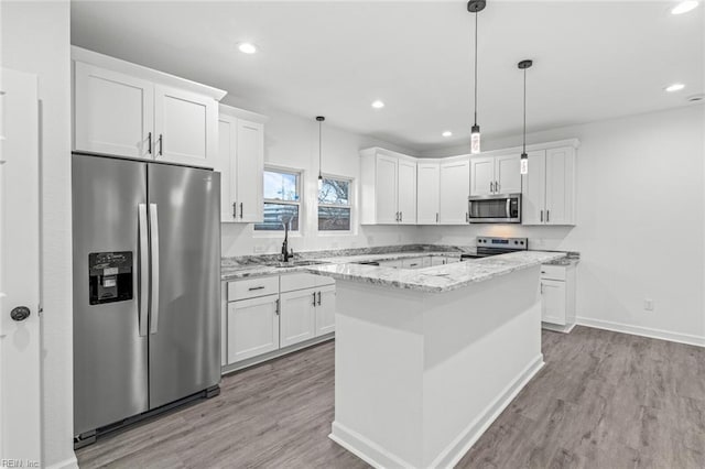 kitchen with white cabinetry and appliances with stainless steel finishes