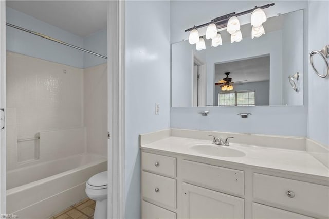 bathroom featuring toilet, ceiling fan, shower / washtub combination, and vanity
