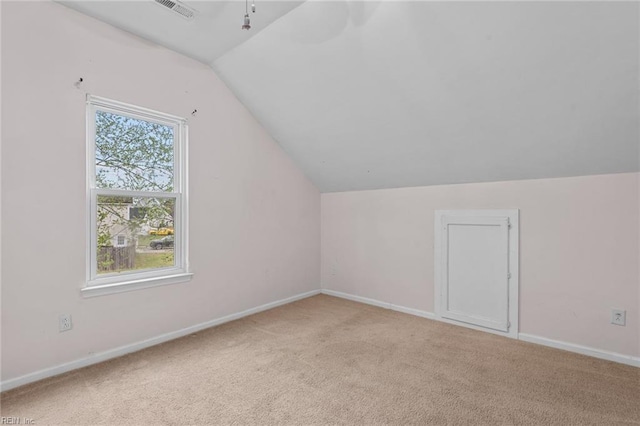 bonus room with carpet, vaulted ceiling, and baseboards