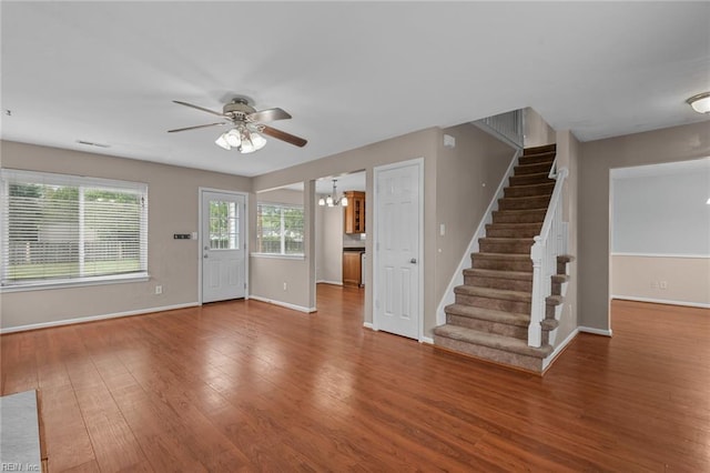 interior space with ceiling fan, stairs, and wood finished floors