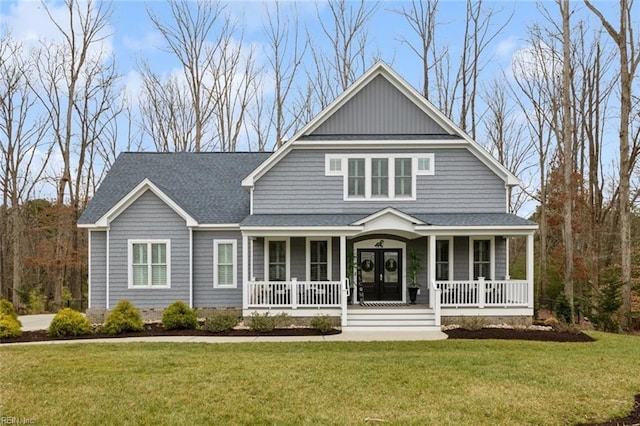 view of front of house with roof with shingles, a front yard, a porch, and french doors