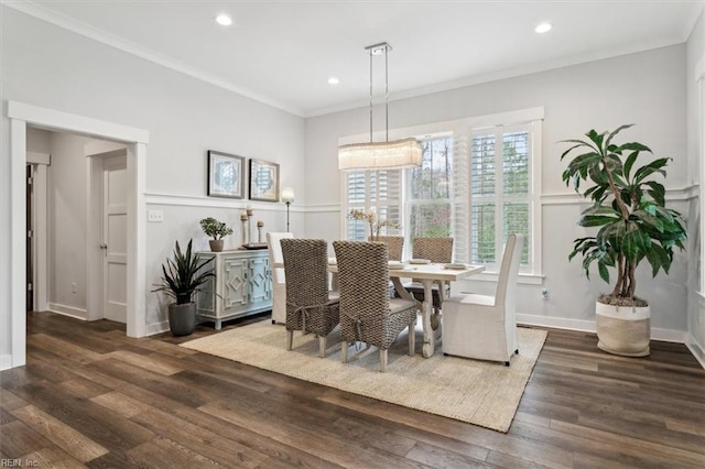 dining room featuring ornamental molding, recessed lighting, baseboards, and wood finished floors