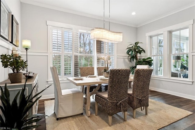 dining room with ornamental molding, recessed lighting, baseboards, and wood finished floors