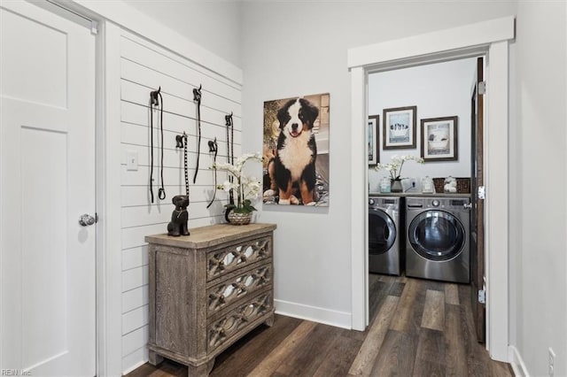 laundry area with laundry area, baseboards, separate washer and dryer, and dark wood-style flooring