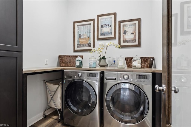 laundry room with laundry area, dark wood-style flooring, and separate washer and dryer