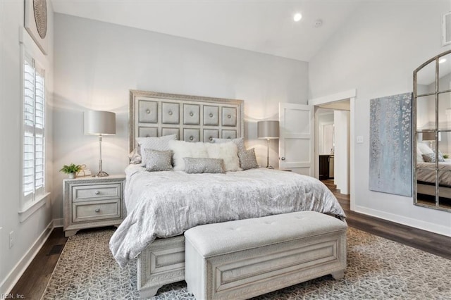 bedroom featuring multiple windows, baseboards, and dark wood finished floors