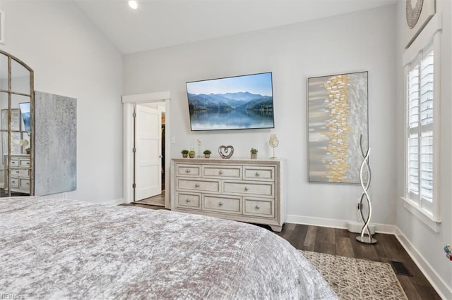 bedroom with dark wood-style floors, multiple windows, vaulted ceiling, and visible vents