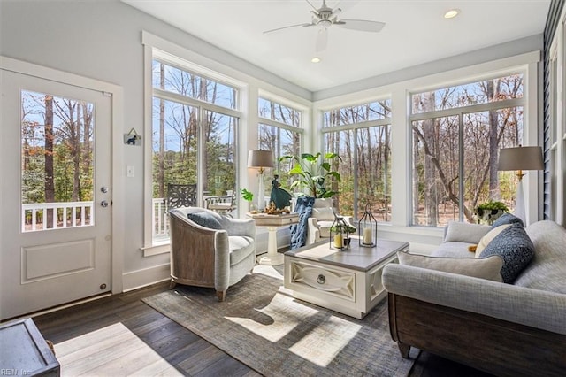 sunroom featuring ceiling fan