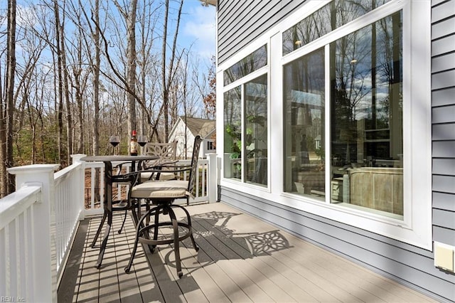 wooden terrace with outdoor dining area