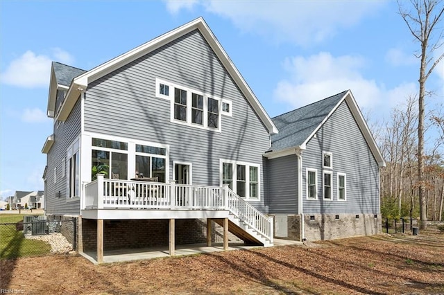 rear view of property with fence, stairway, a patio, and a wooden deck