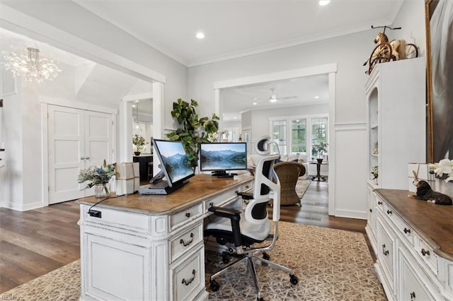 home office with ceiling fan with notable chandelier, dark wood finished floors, crown molding, and recessed lighting