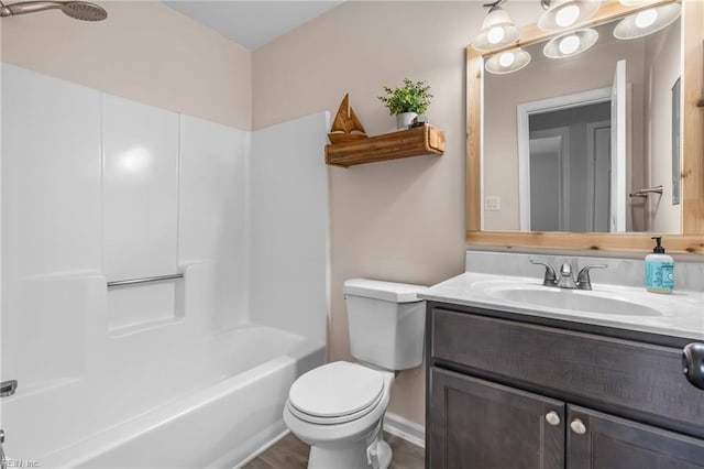 full bathroom with tub / shower combination, vanity, and toilet