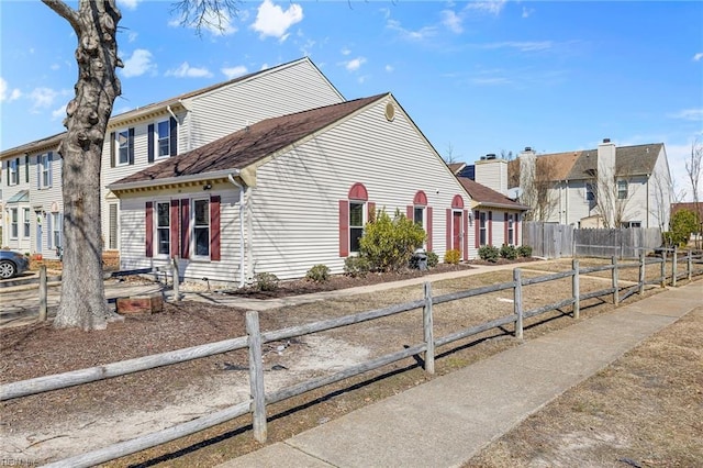 view of front facade featuring a fenced front yard and a residential view