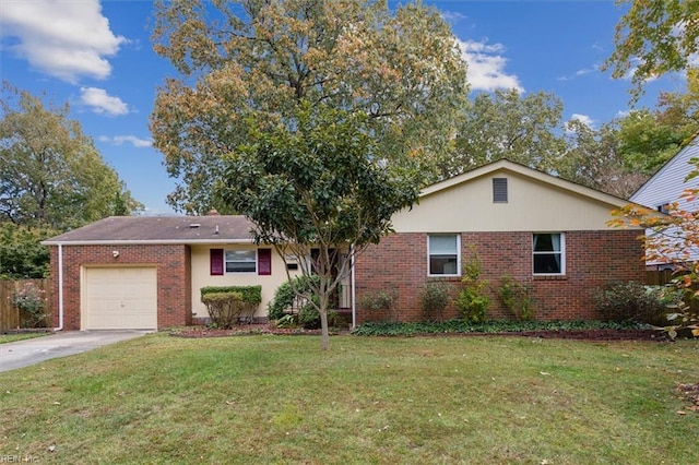 ranch-style house with driveway, fence, a front yard, a garage, and brick siding