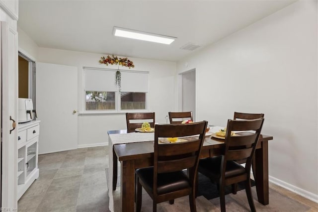 dining area with visible vents and baseboards