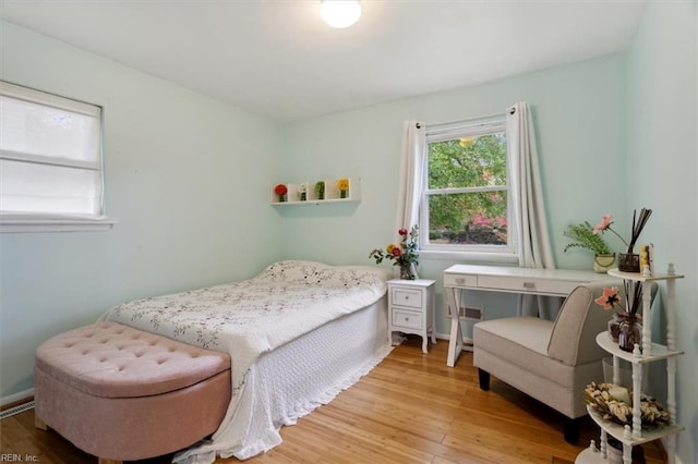 bedroom with light wood-style floors