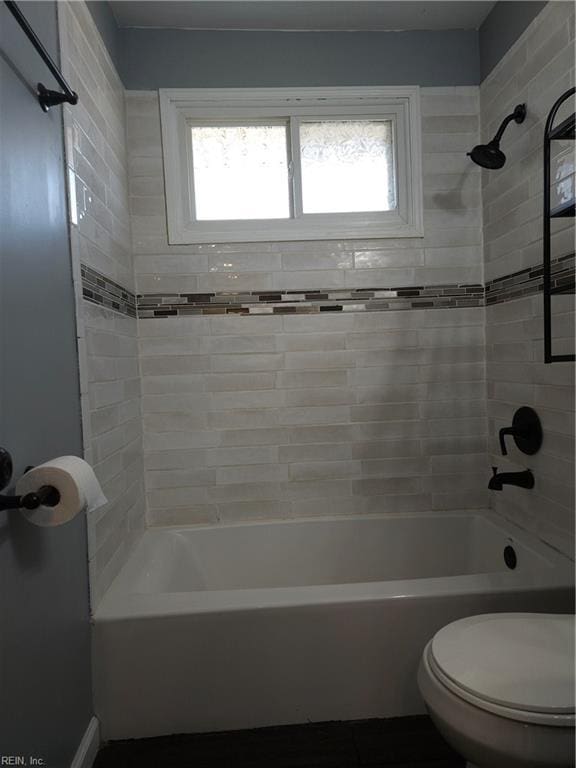 full bathroom featuring shower / bathtub combination and toilet