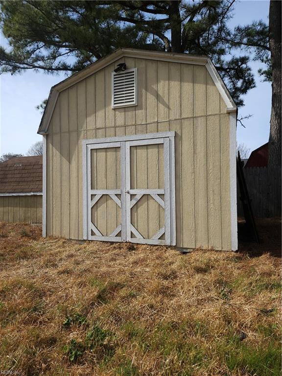 view of shed with fence