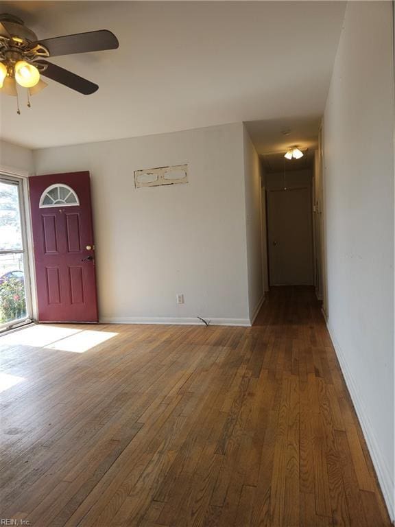 entryway with wood-type flooring, baseboards, and ceiling fan