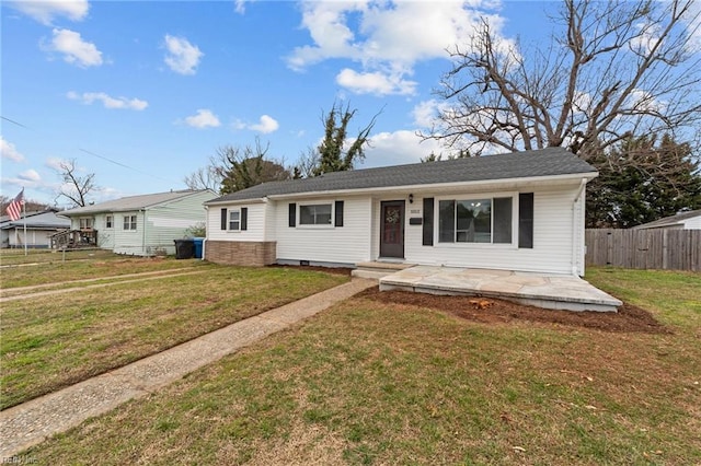 view of front facade with a front yard and fence