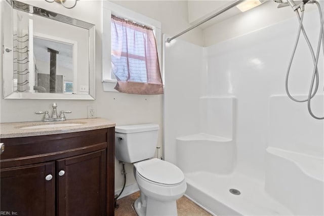 full bath with vanity, toilet, and walk in shower