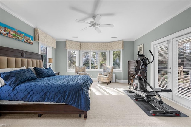 bedroom with crown molding, baseboards, carpet floors, a ceiling fan, and access to outside