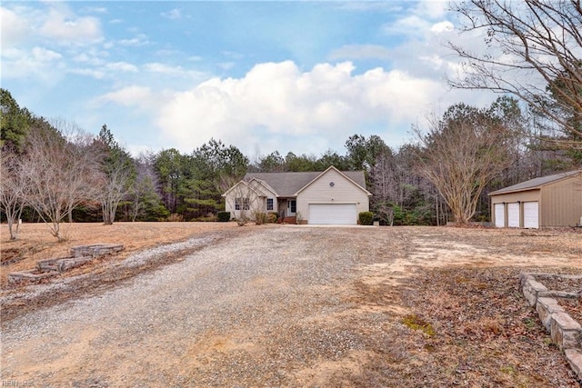 ranch-style house with a garage and driveway