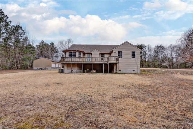 back of house with crawl space and a deck