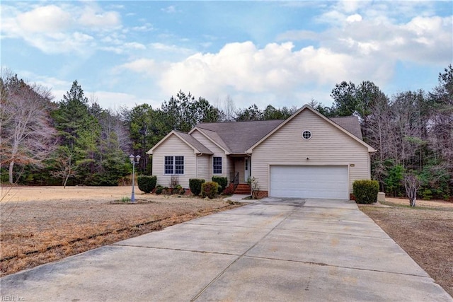 ranch-style house featuring driveway and a garage