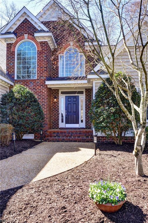 view of front of house with brick siding