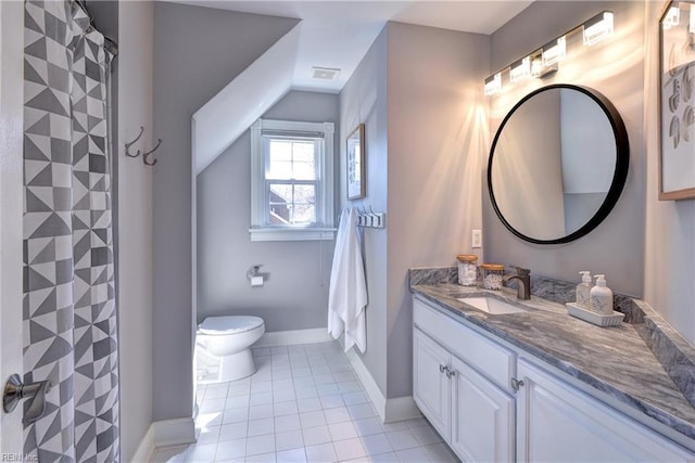 bathroom featuring baseboards, toilet, vanity, and tile patterned flooring