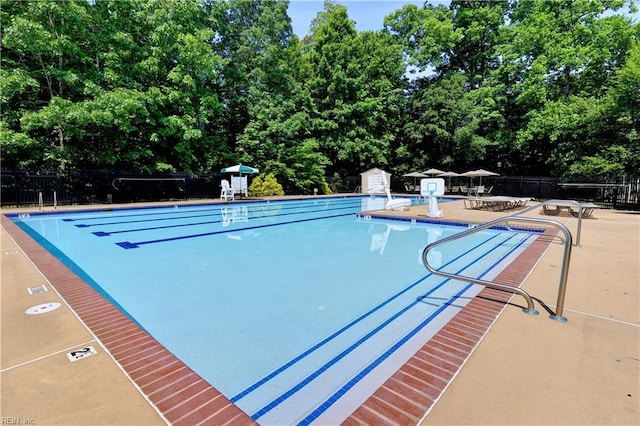 pool featuring a patio area and fence