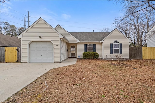 ranch-style home with driveway, roof with shingles, an attached garage, and fence