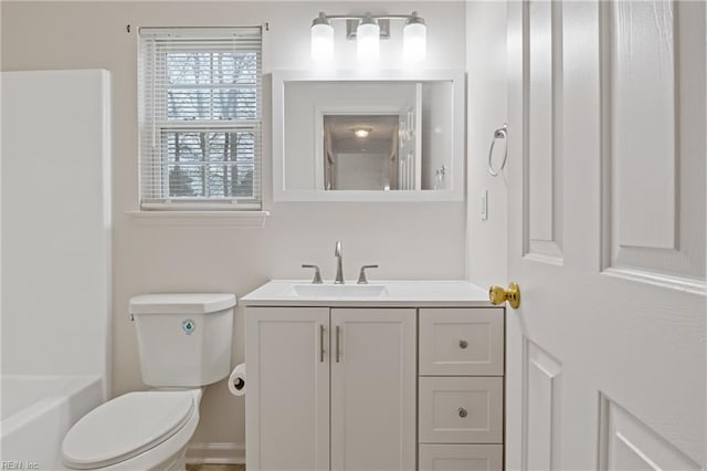 bathroom featuring vanity and toilet