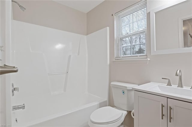 bathroom with toilet, shower / tub combination, and vanity