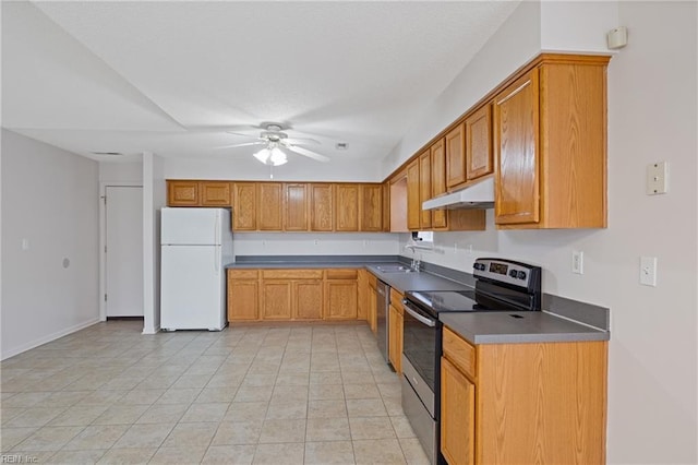 kitchen featuring brown cabinets, appliances with stainless steel finishes, a ceiling fan, a sink, and under cabinet range hood