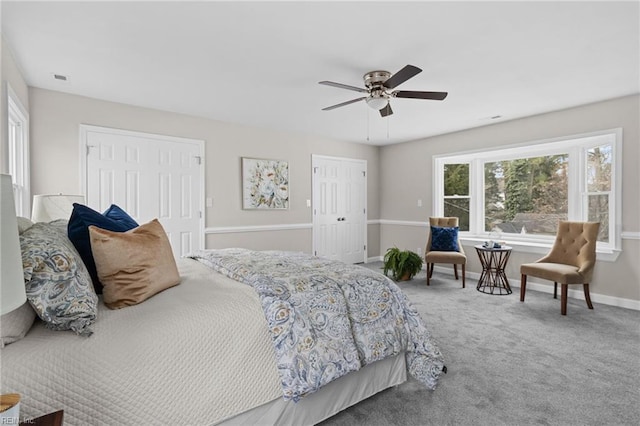 carpeted bedroom featuring a ceiling fan and baseboards